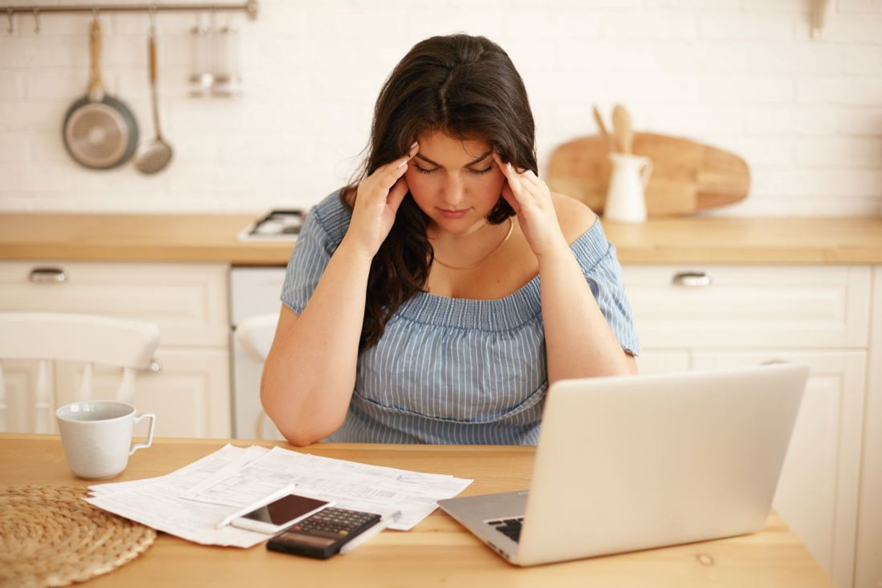 Person managing finances and debt after divorce