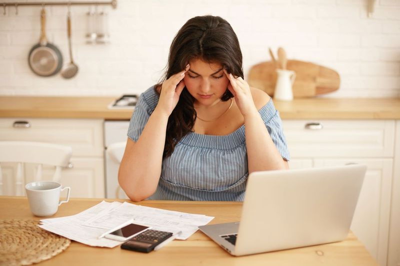 Person managing finances and debt after divorce